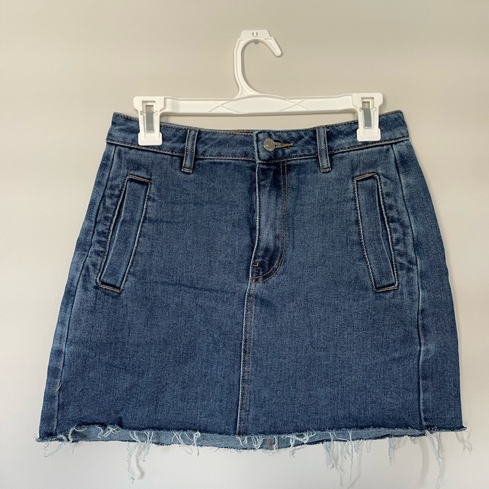 Pacsun dark wash denim skirt. Minimal distressing on the bottom. Size 26
